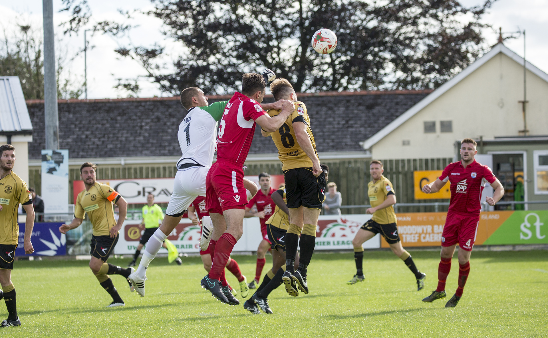 Nomads Captain Goerge Horan challenges Carmarthen's Lee Idzi and Matthew Thomas - © - NCM Media