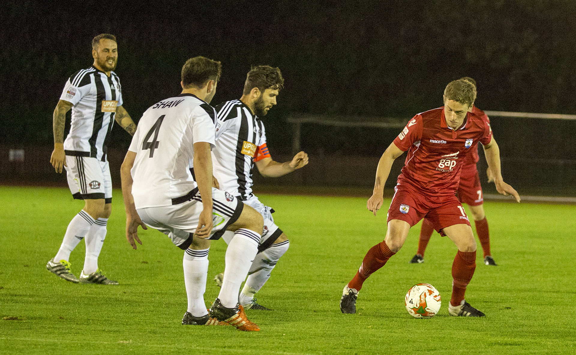 Nick Rushton takes on the Llandudno defence - © NCM Media