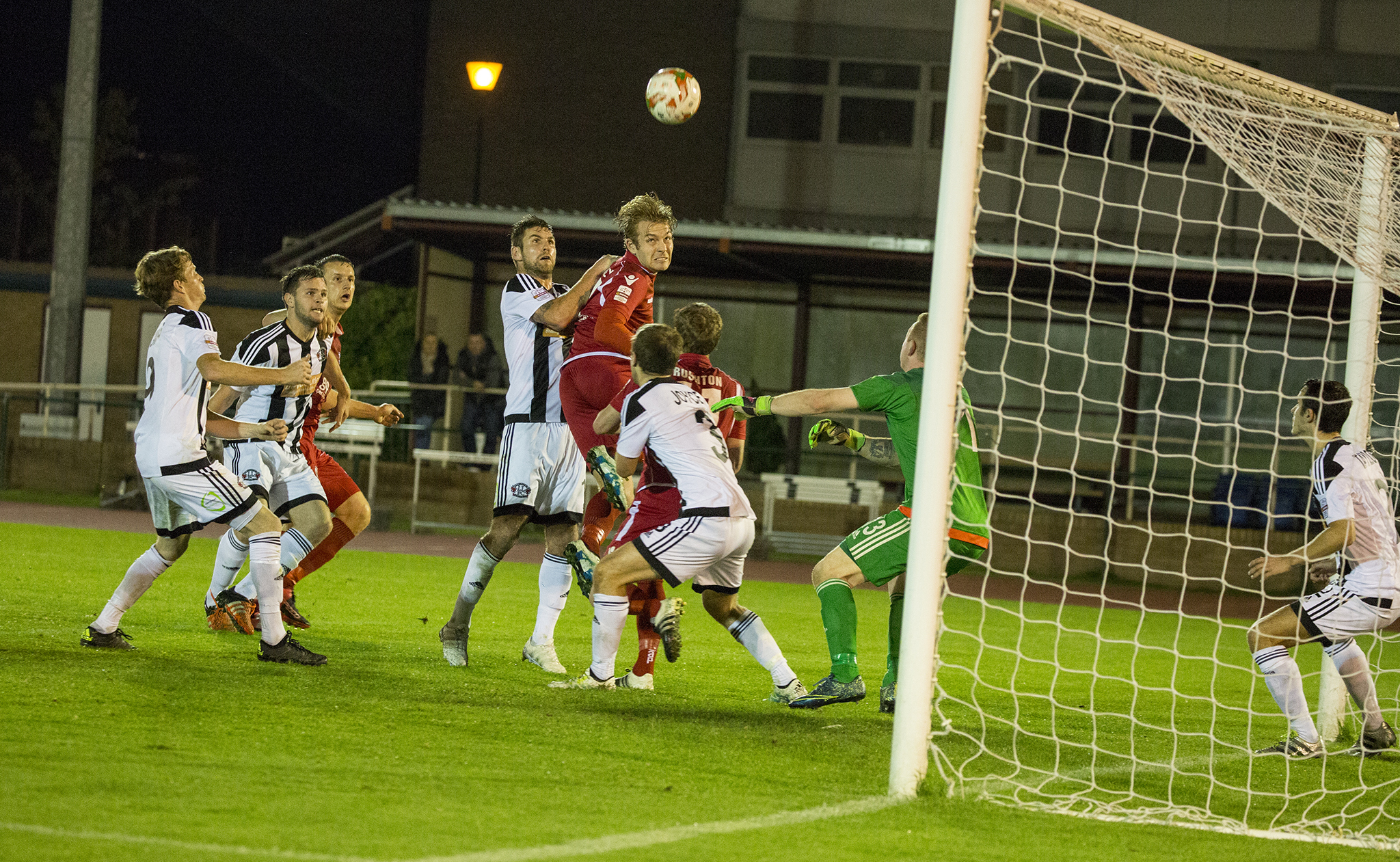 John Disney challenges for a second half header - © NCM Media