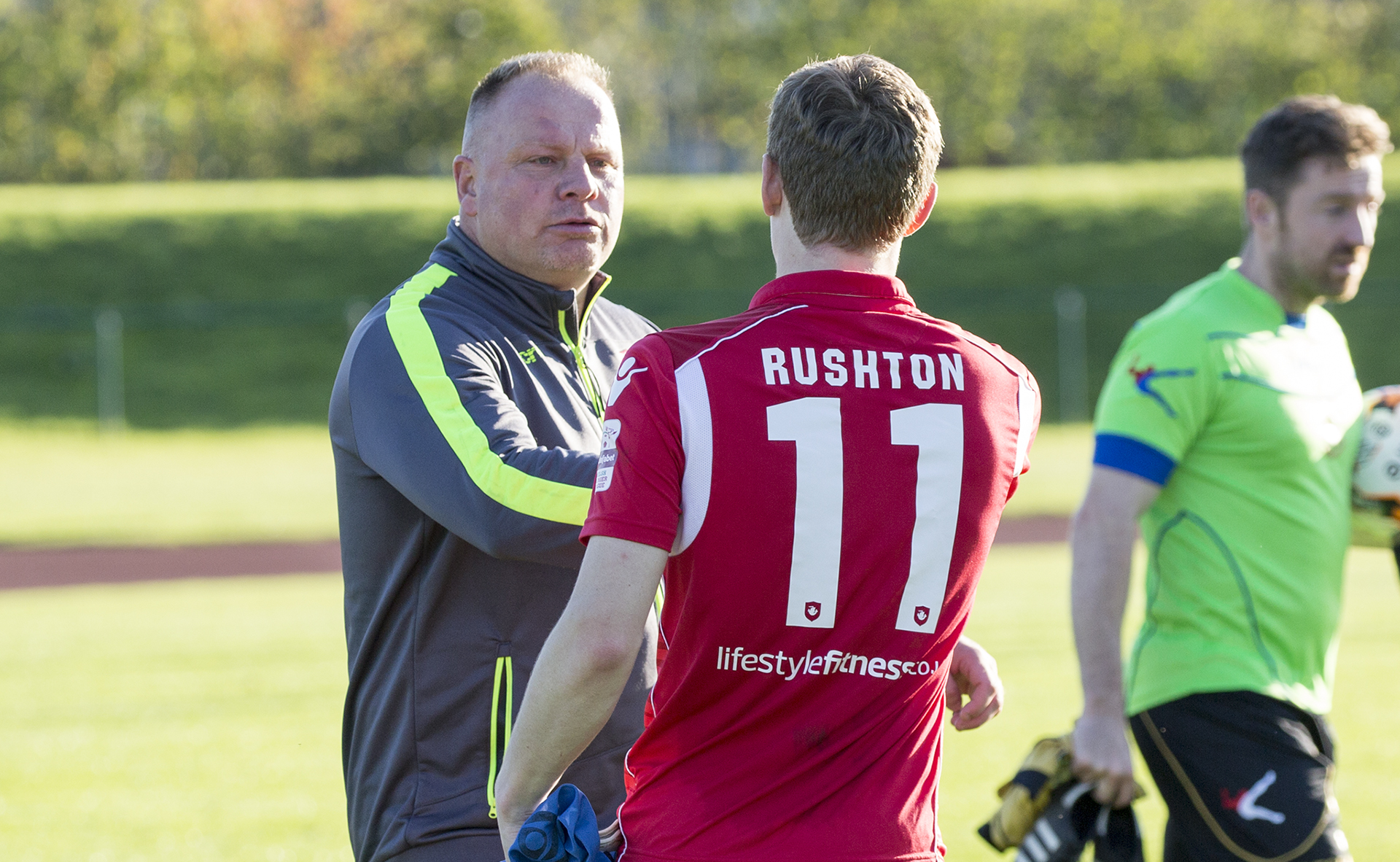 Manager Andy Morrison celebrates with goalscorer Nick Rushton at full time - © NCM Media