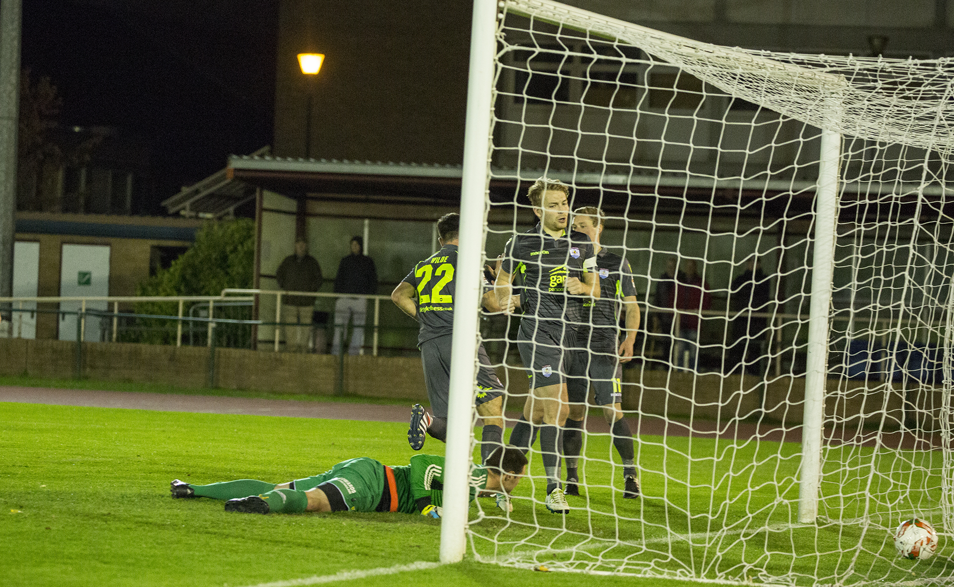 Michael Wilde wheels away to celebrate his first and The Nomads' second goal of the game - © NCM Media