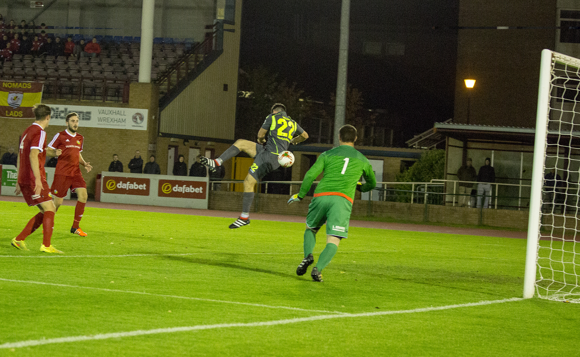 Michael Wilde cleverly scores The Nomads' third of the game - © NCM Media