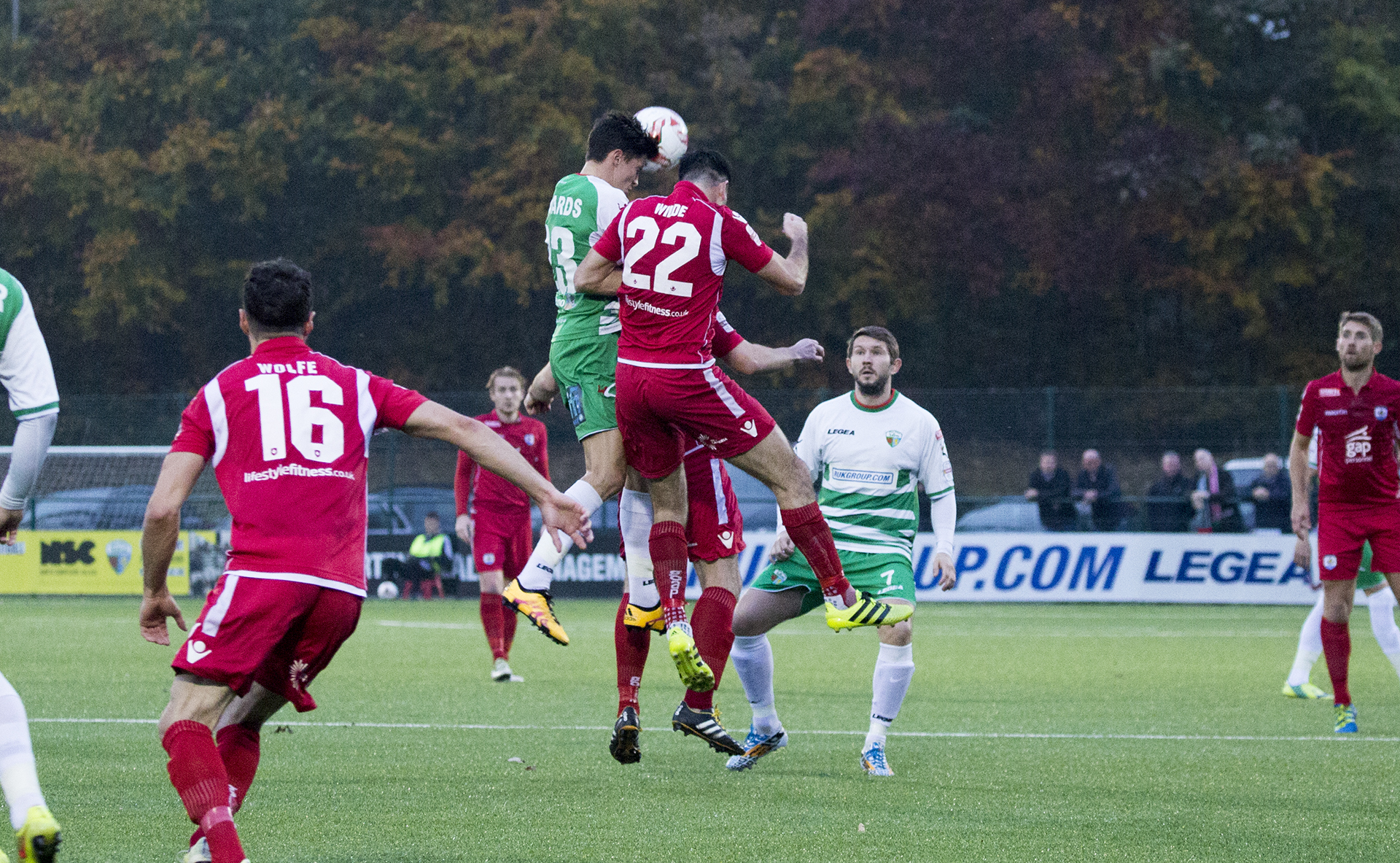 Michael Wilde and Aeron Edwards battle for the ball - © NCM Media