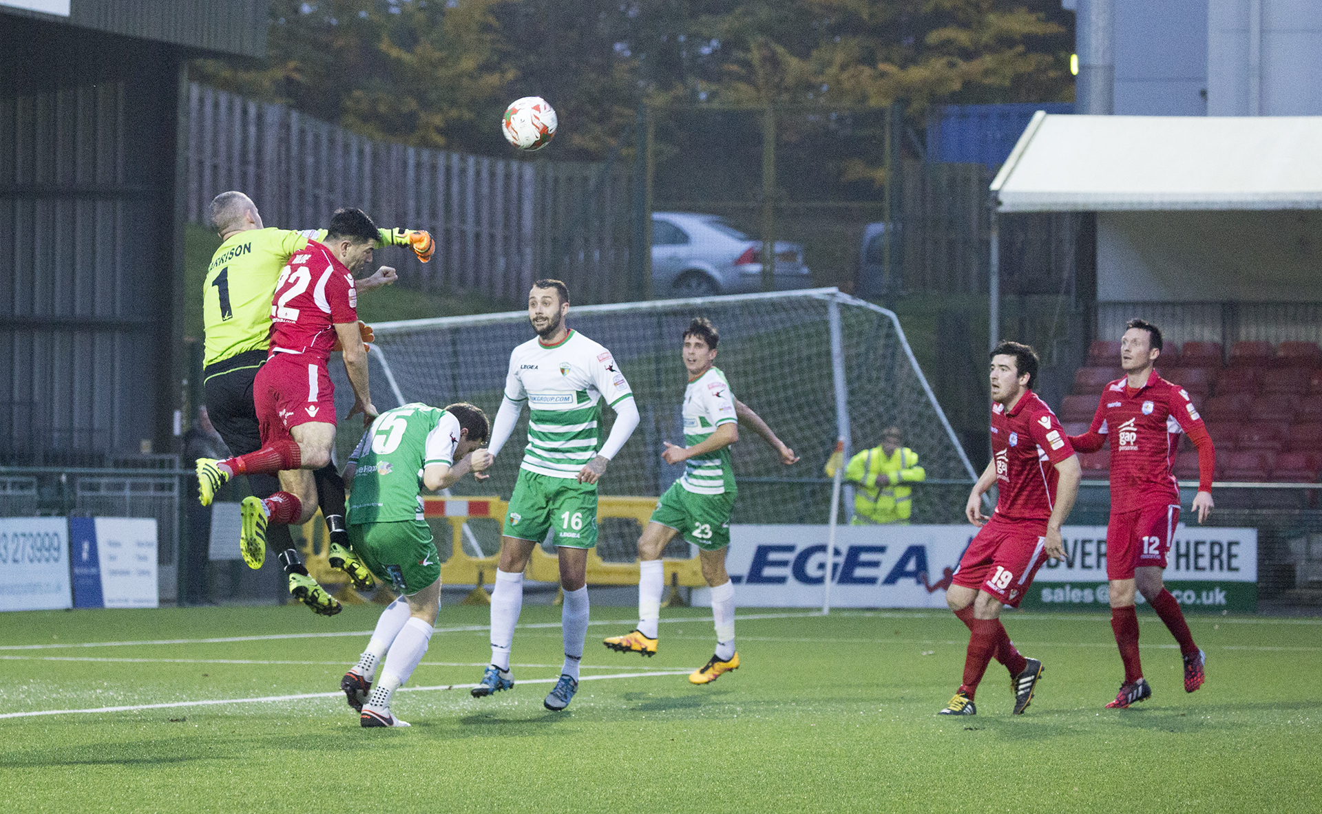 Paul Harrison beats Michael Wilde to the ball - © NCM Media