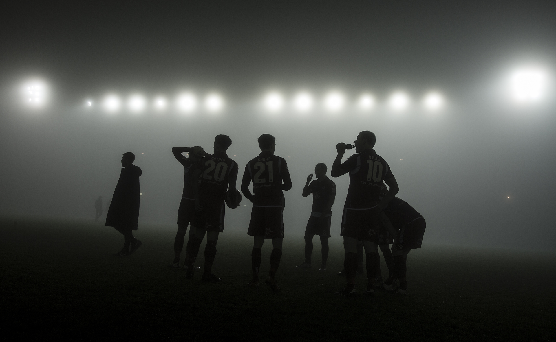 The Nomads players look on as fog calls a halt to the game - © NCM Media 2016
