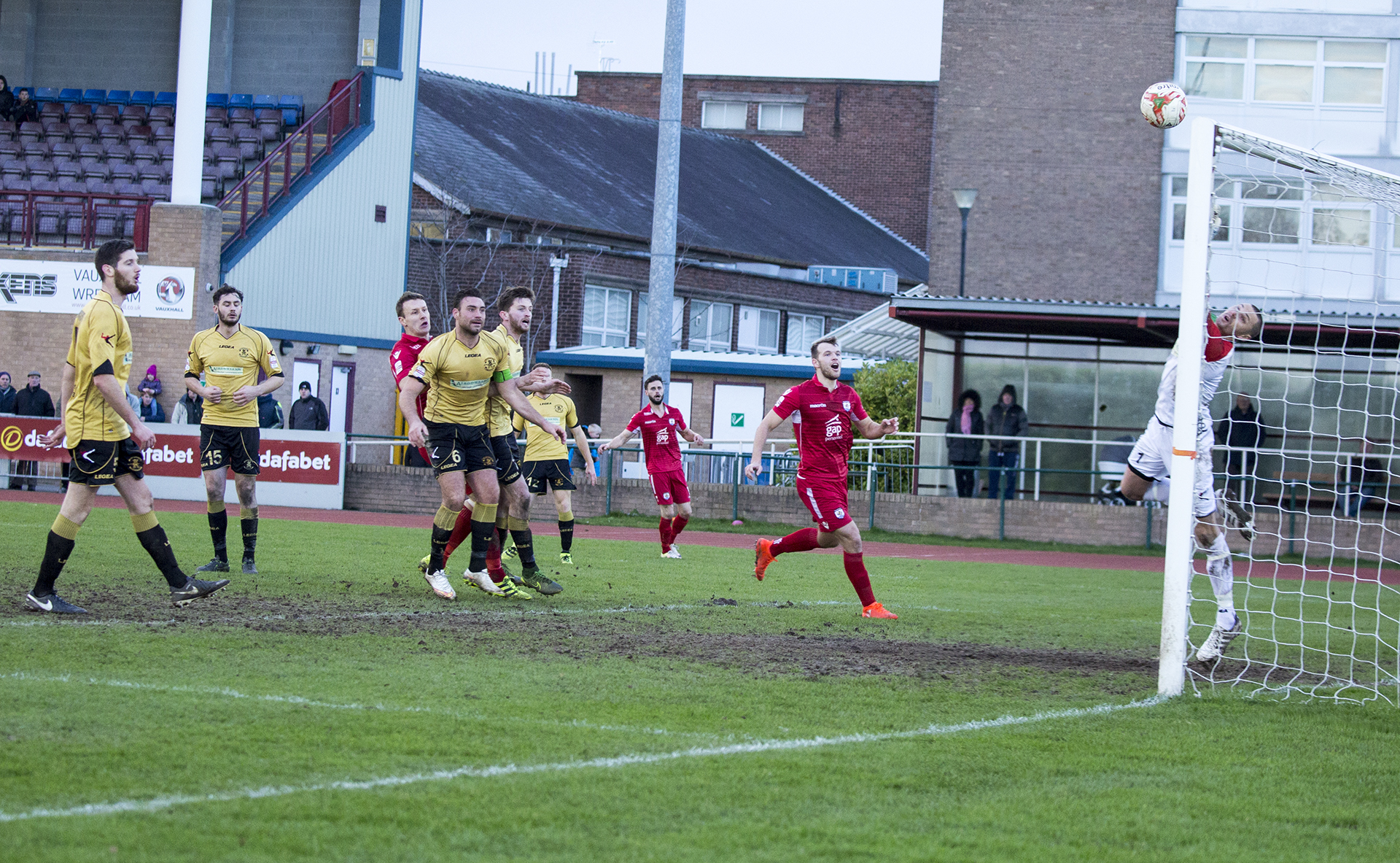 Les Davies sees his effort sail just over Lee Idzi's crossbar - © NCM Media