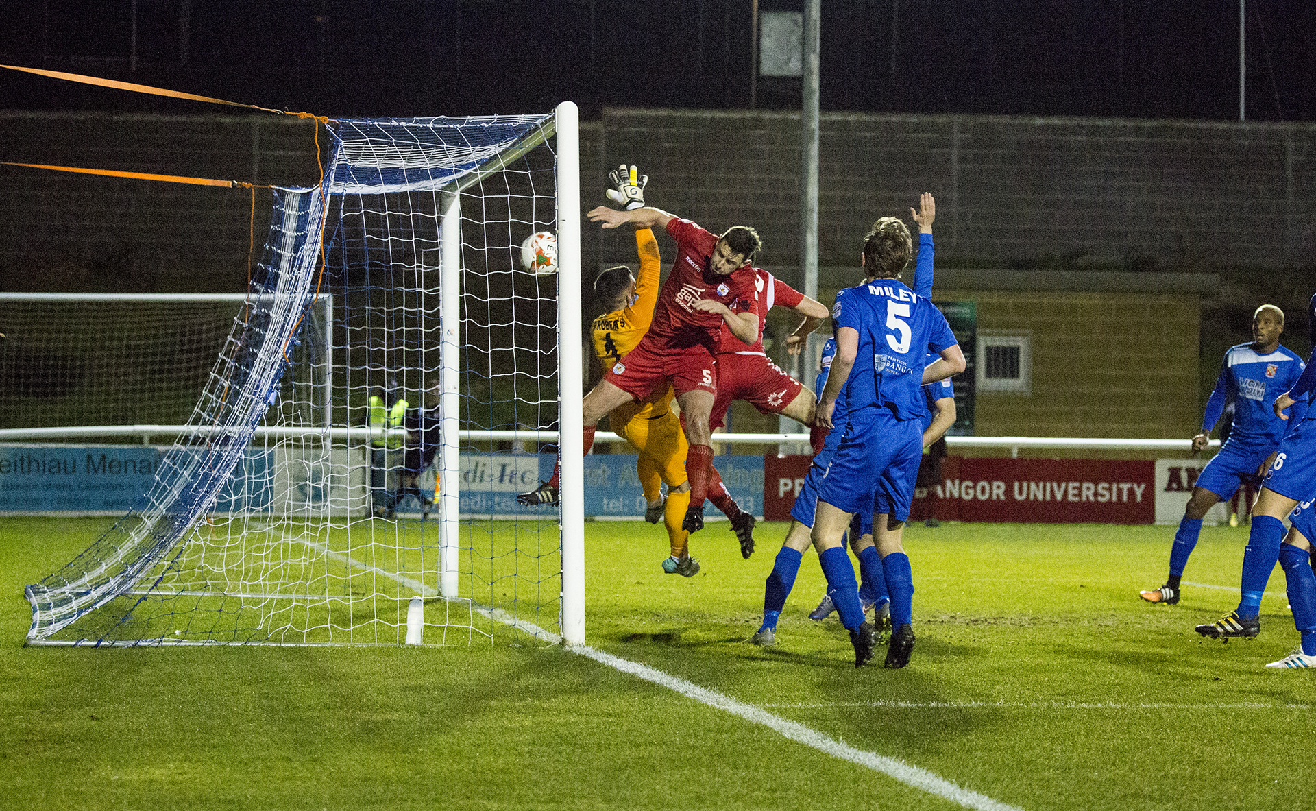 George Horan bundles the ball into the Bangor net only to see the attempt disallowed - © NCM Media