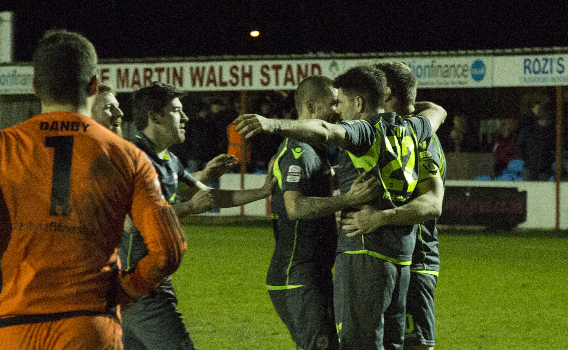 The Nomads celebrate Michael Wilde's winning penalty - © NCM Media