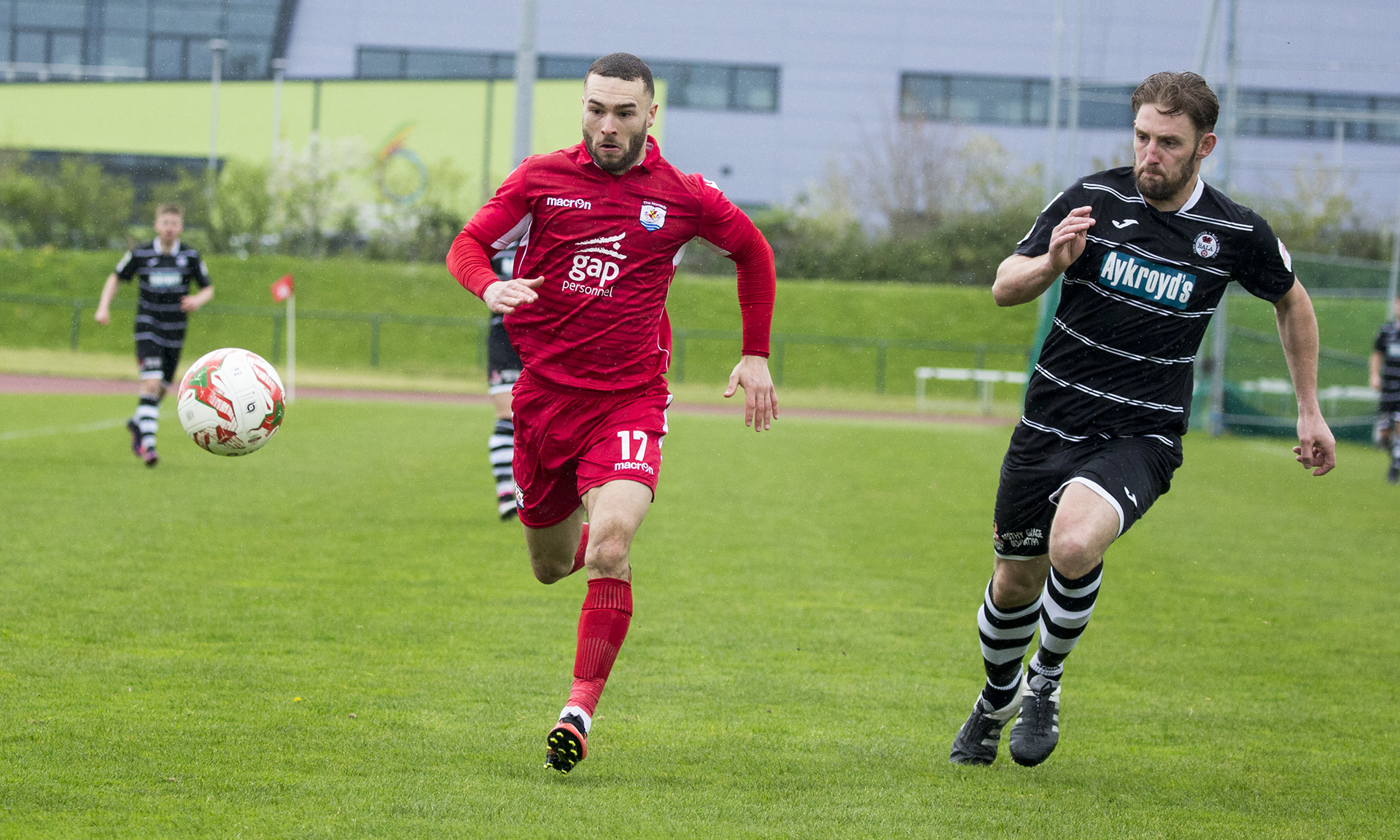 Ryan Wignall gets round the back of the Bala defence - © NCM Media