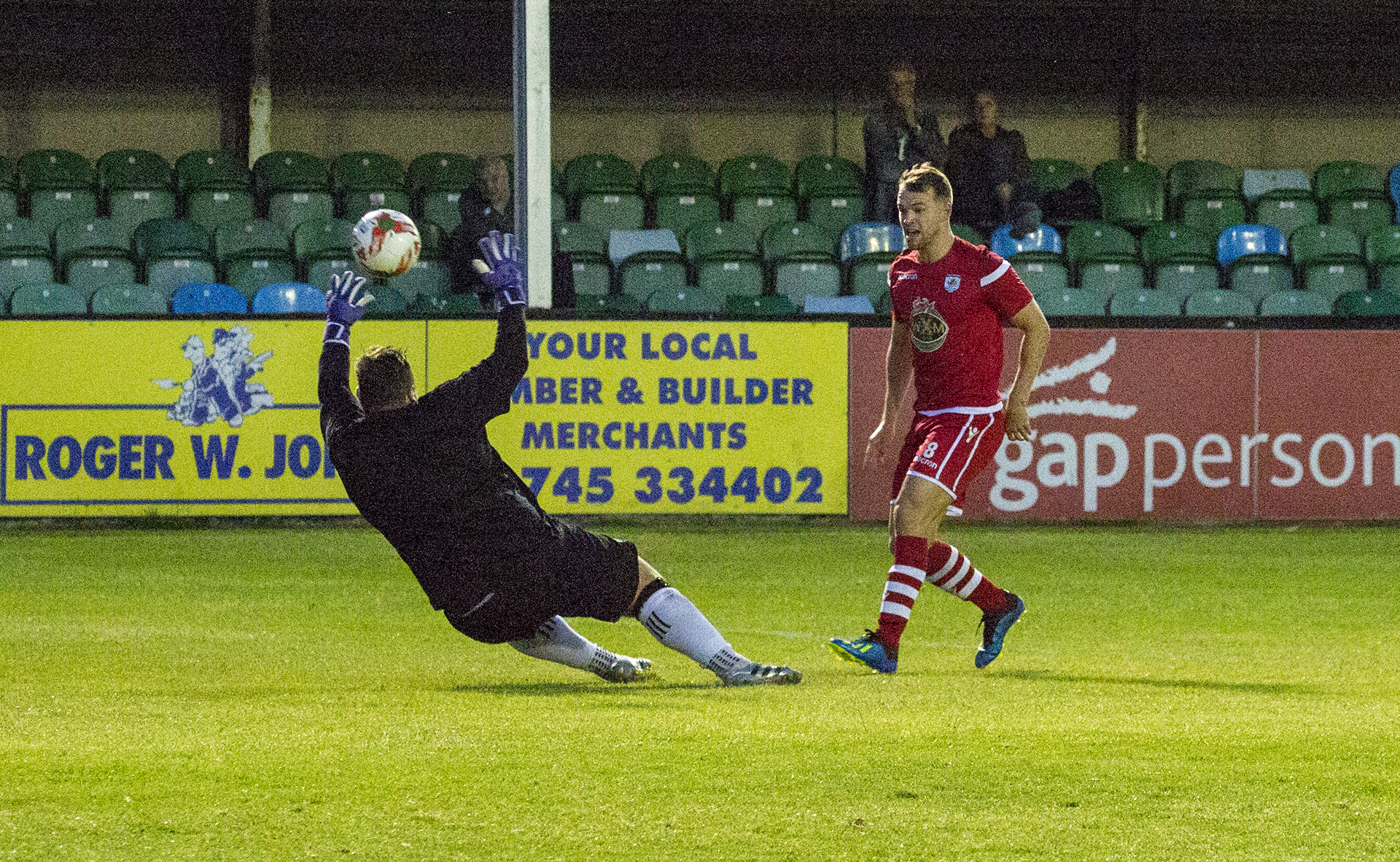 Callum Morris lifts the ball over Jon Hill-Dunt to give The Nomads the lead © NCM Media