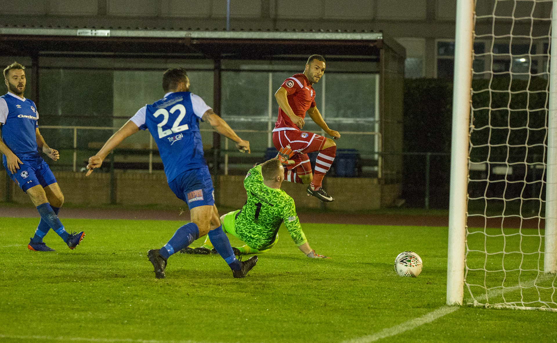Ryan Wignall slots beyond Dave Roberts in the Airbus goal to make it 5-1 © NCM Media