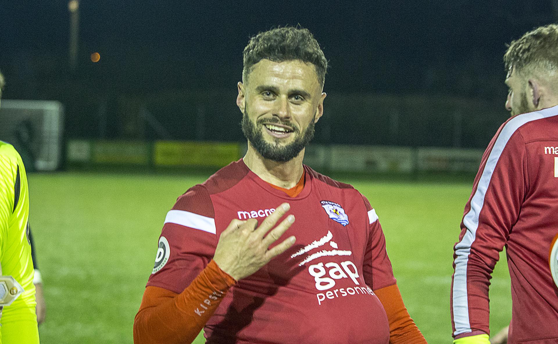 Hat-trick hero Nathan Woolfe celebrates with the matchball | © NCM Media
