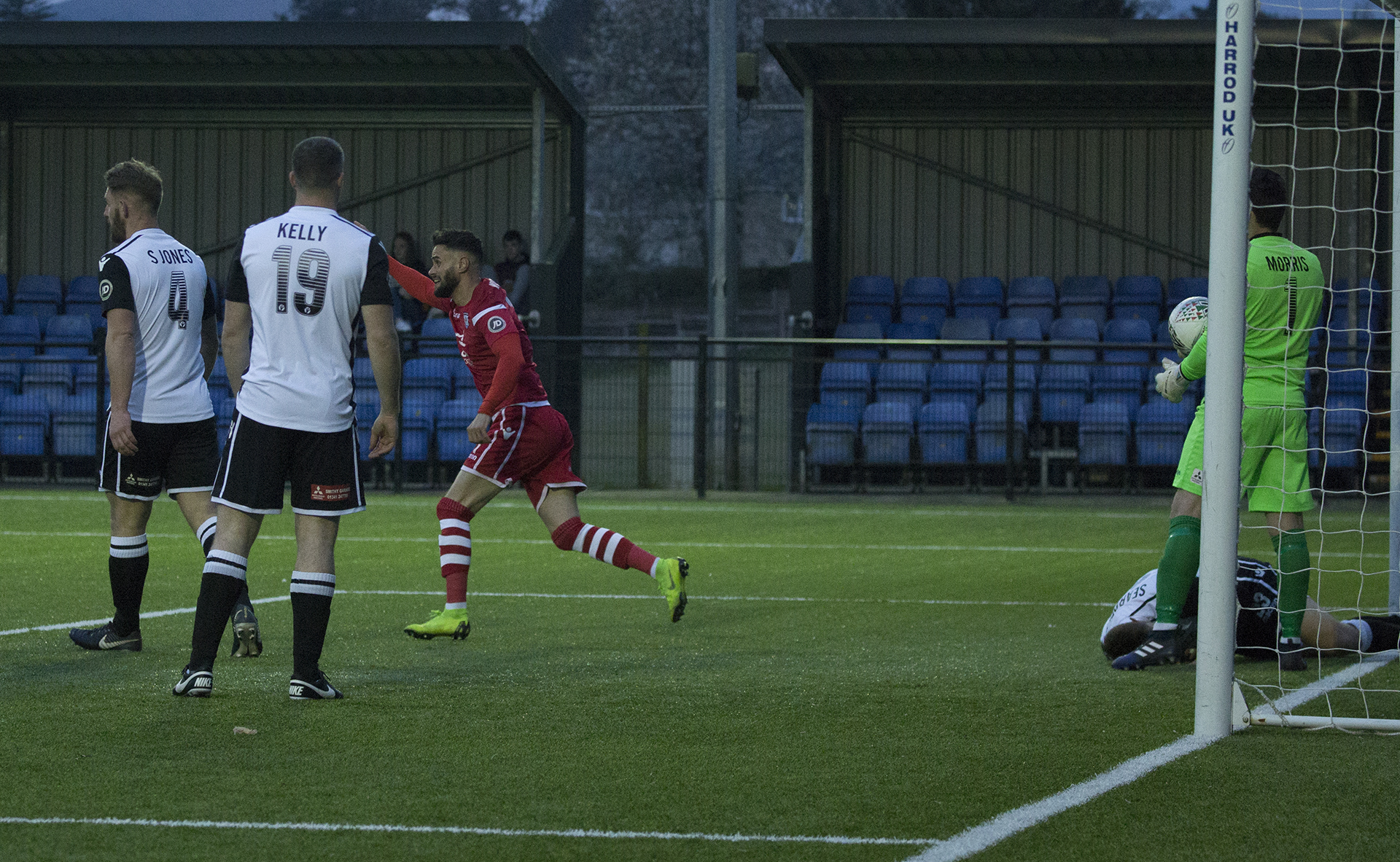 Nathan Woolfe wheels away celebrating his first goal | © NCM Media