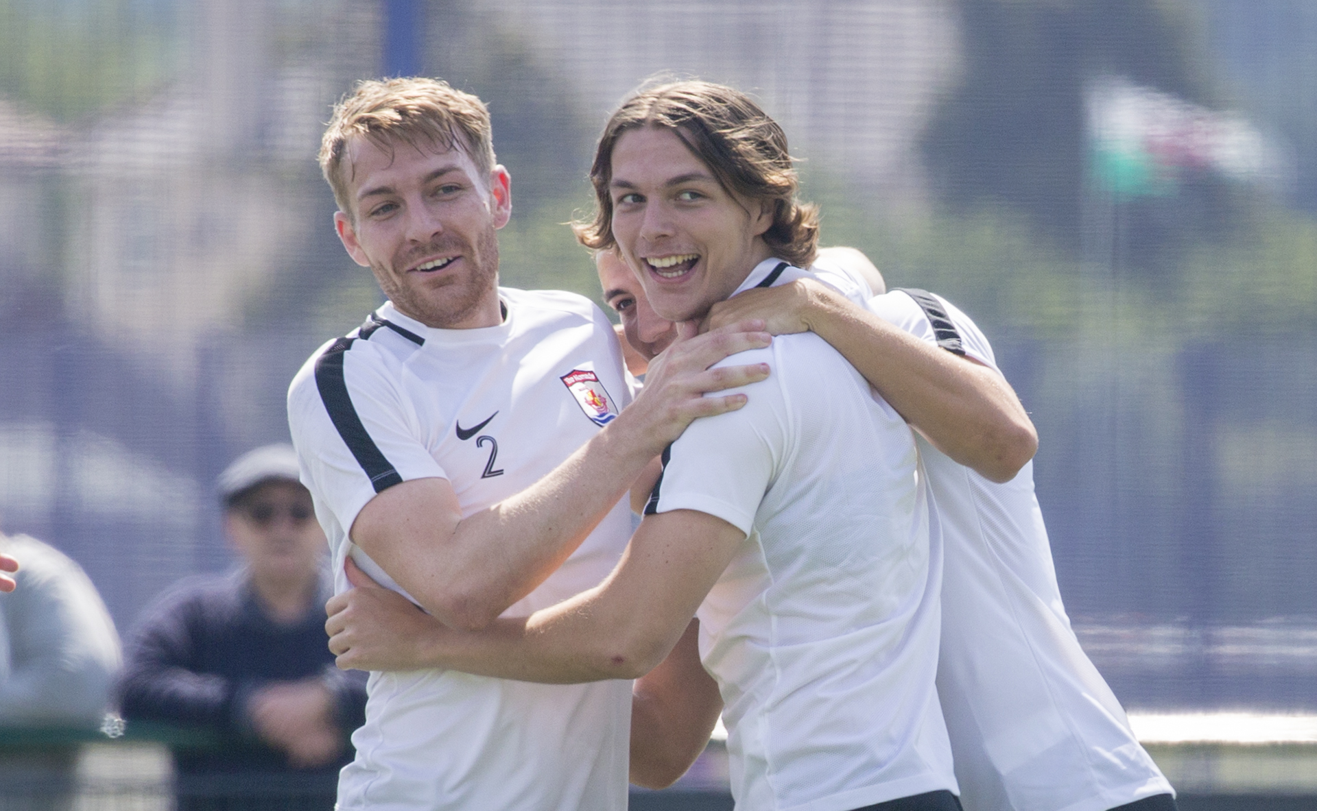 Conor Harwood is congratulated following his match winning header | © NCM Media