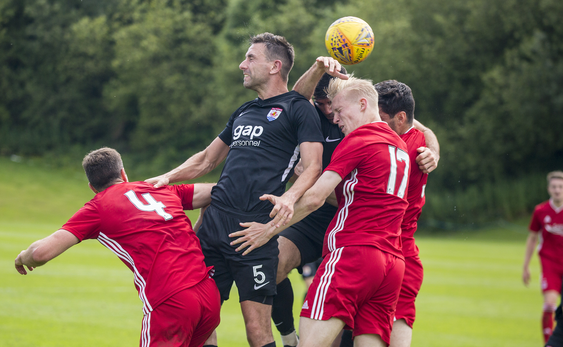 George Horan and Michael Wilde challenge for an aerial ball | © NCM Media