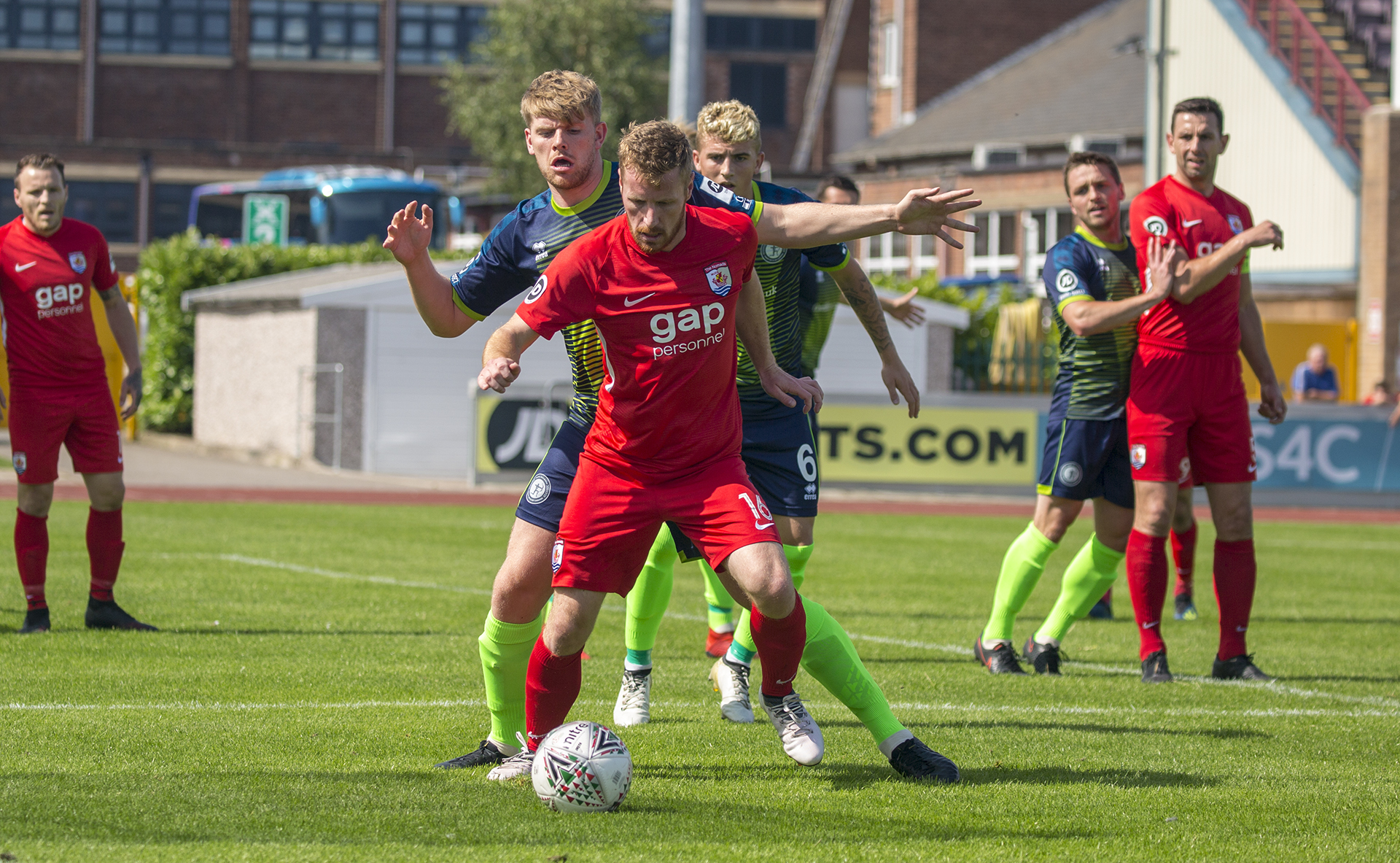 Jay Owen and Emlyn Lewis battle for possession | © NCM Media