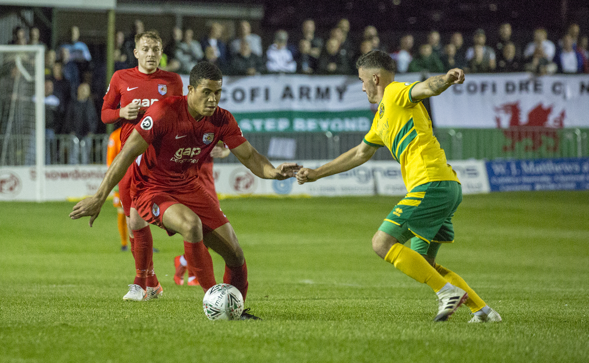 Priestley Farquharson breaks through the Caernarfon defence | © NCM Media