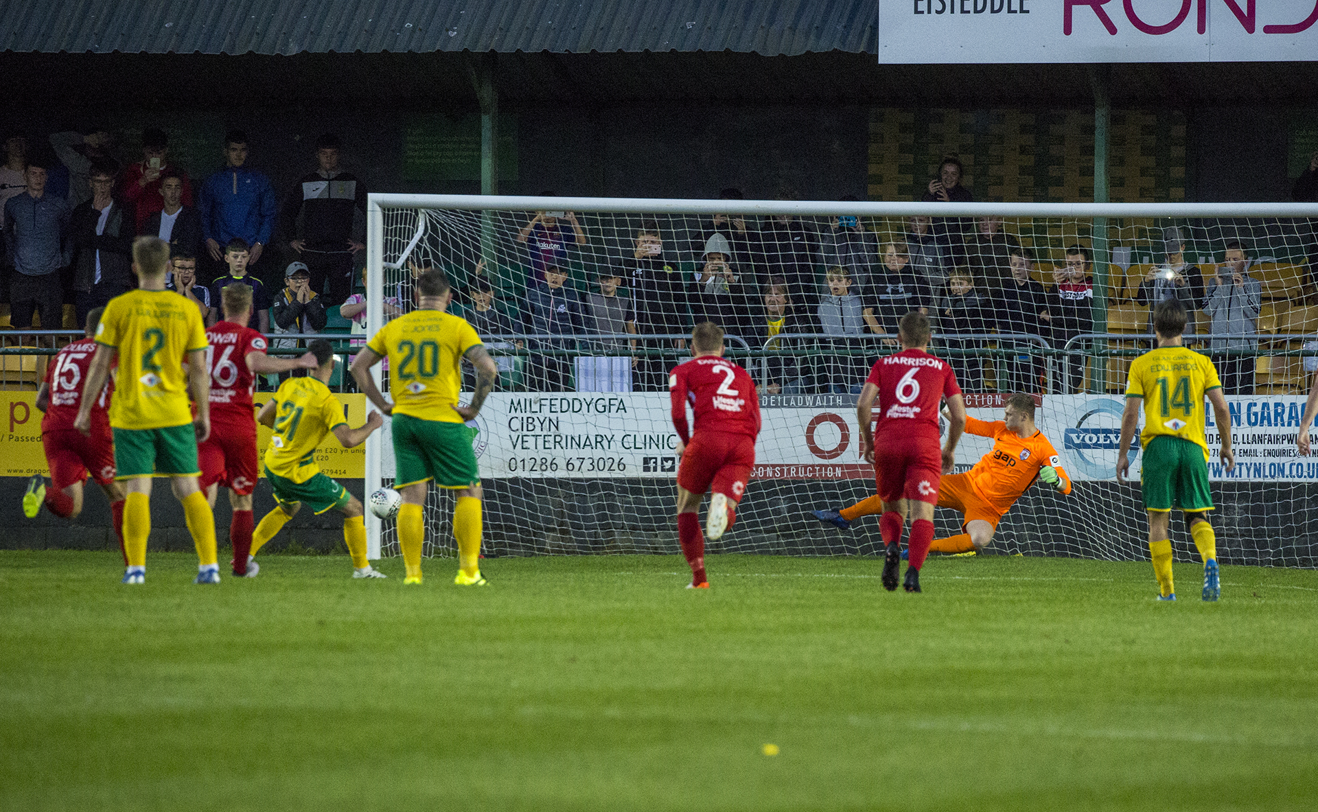 Caernarfon's Leo Smith sees his first half penalty come back off the post | © NCM Media