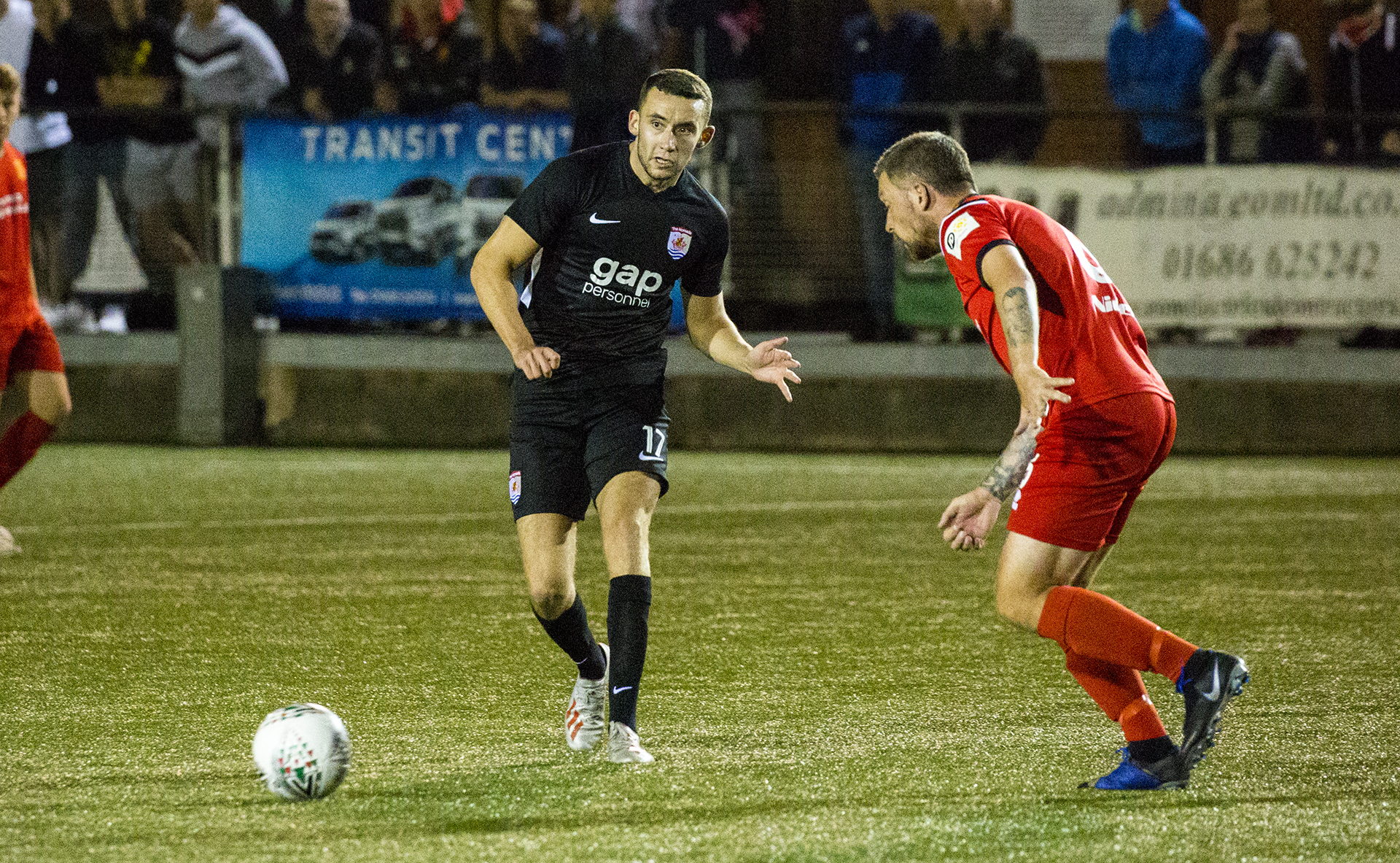 Kris Owens looks to find a way through the Newtown defence | © NCM Media