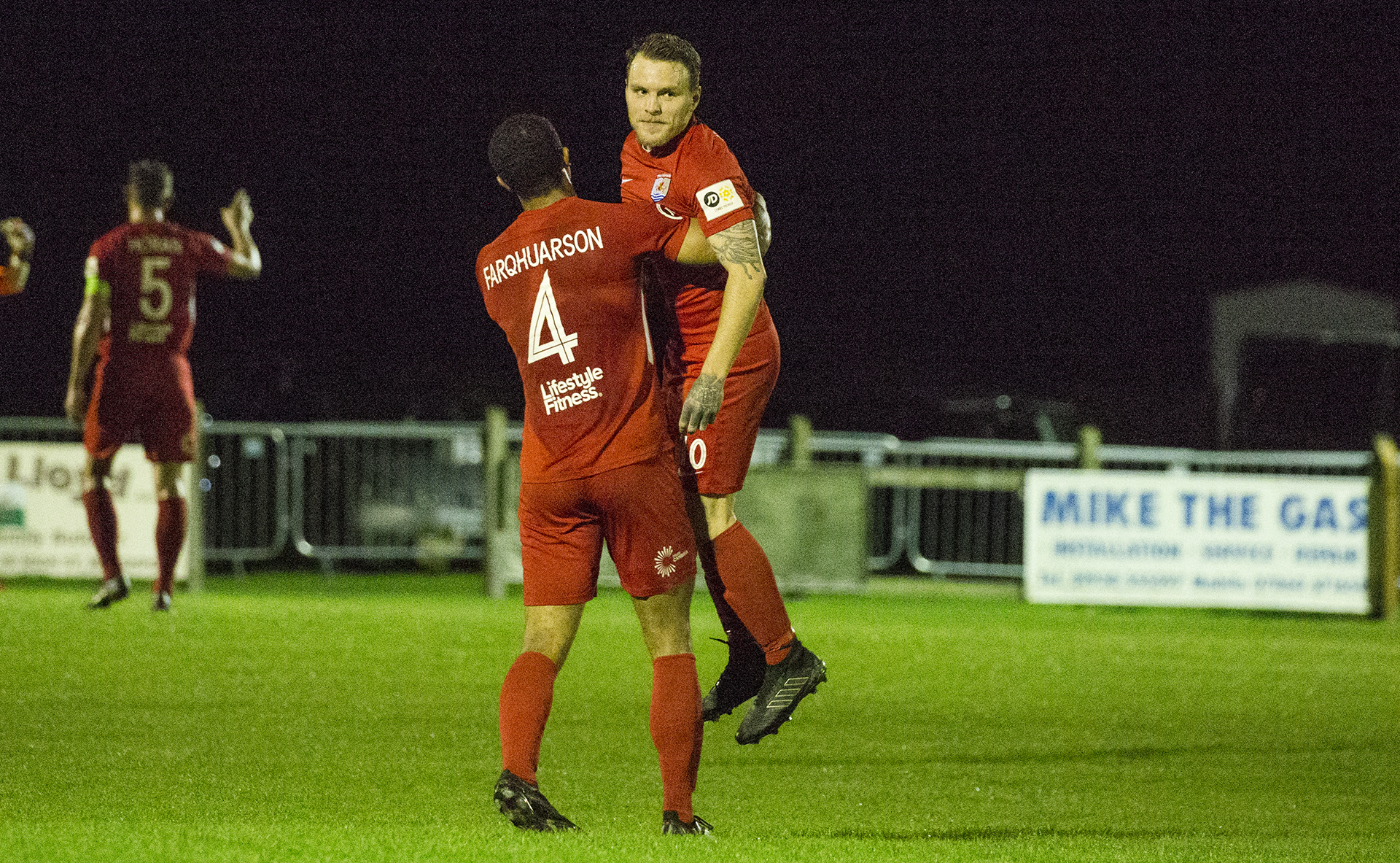 Priestley Farquharson hoists Jamie Insall up to celebrate his opening goal | © NCM Media