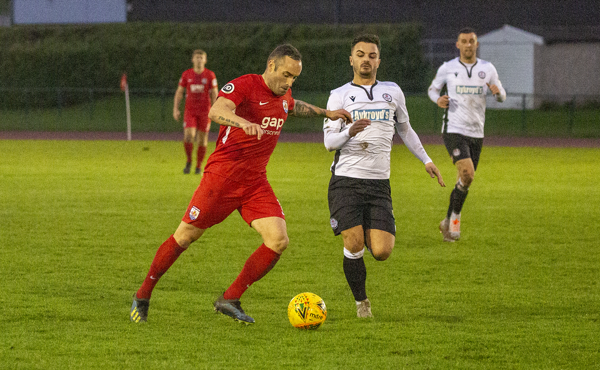 Danny Holmes sends a cross into the Bala box | Photo: Tom Houghton