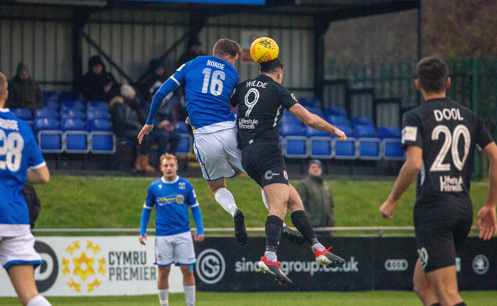 Michael Wilde wins a header | Photo: Tom Houghton