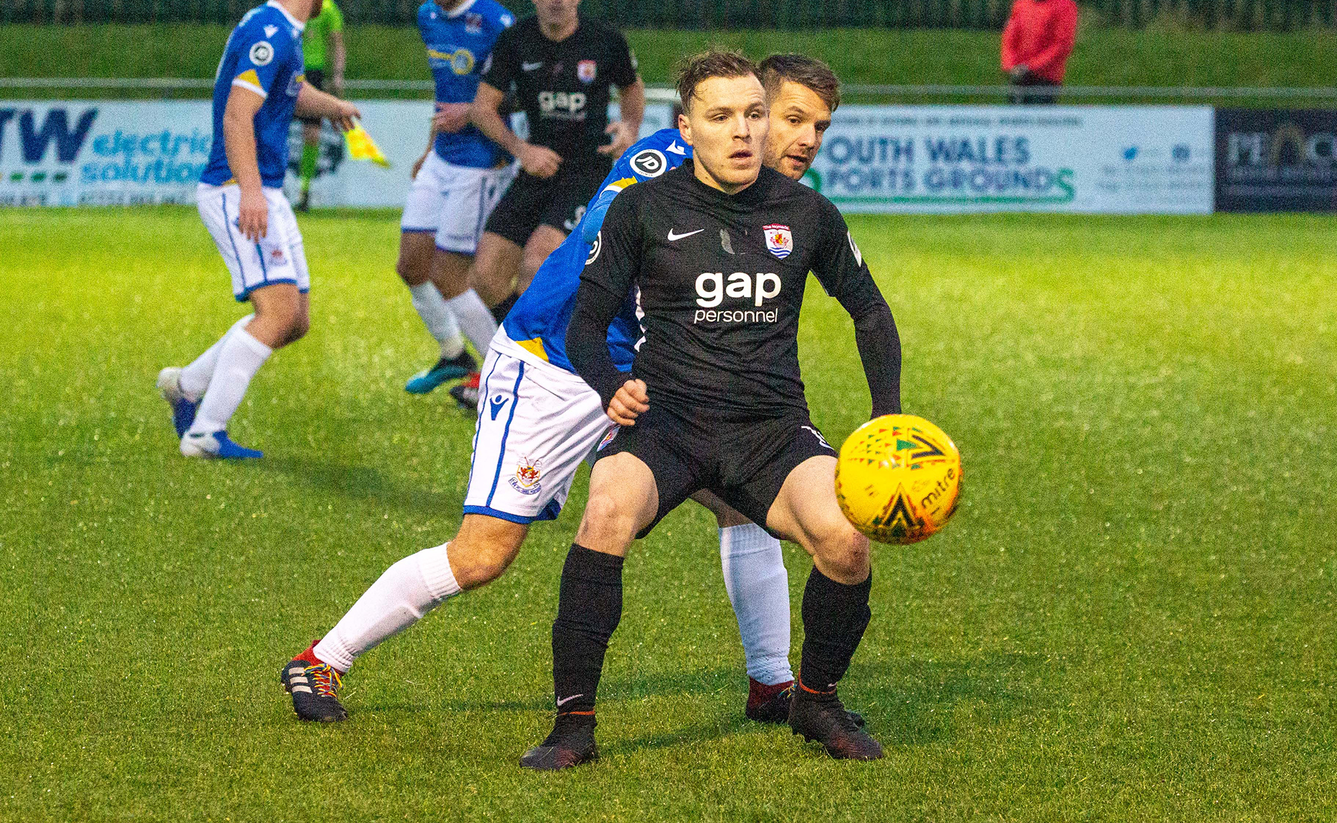 Jamie Insall holds up the ball | Photo: Tom Houghton