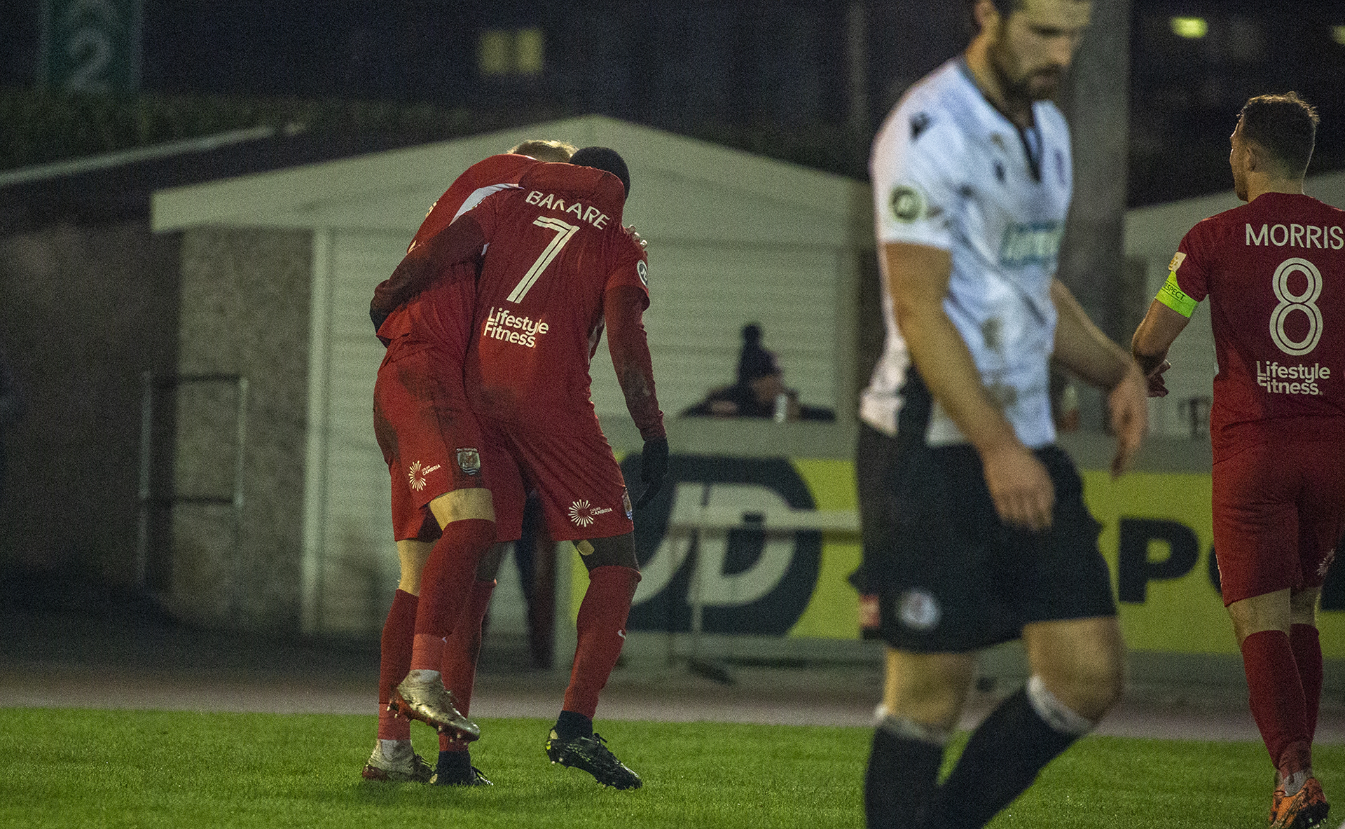 Michael Bakare is congratulated following his match-winning header | © NCM Media