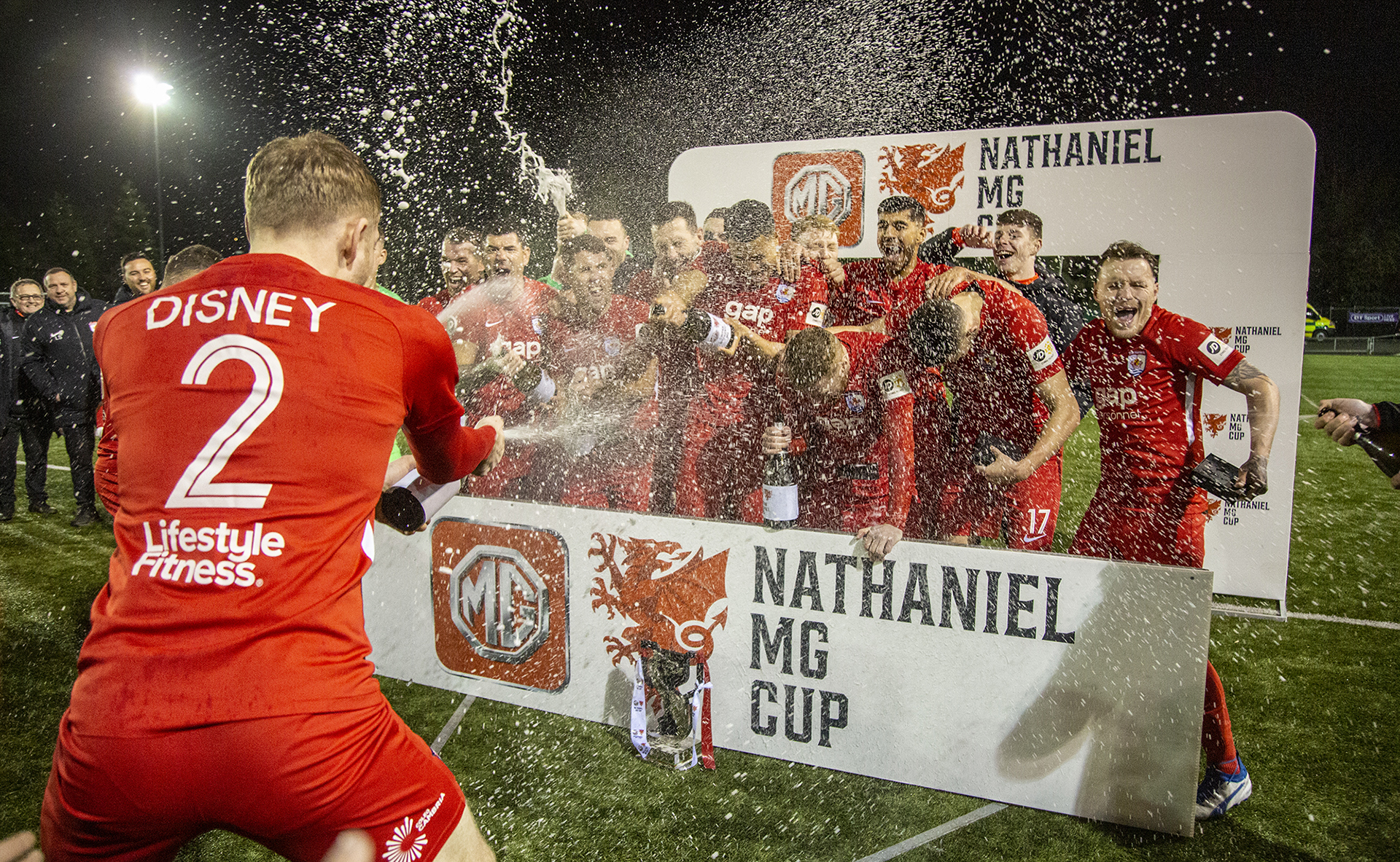 The Nomads' players celebrate with the champagne | © NCM Media