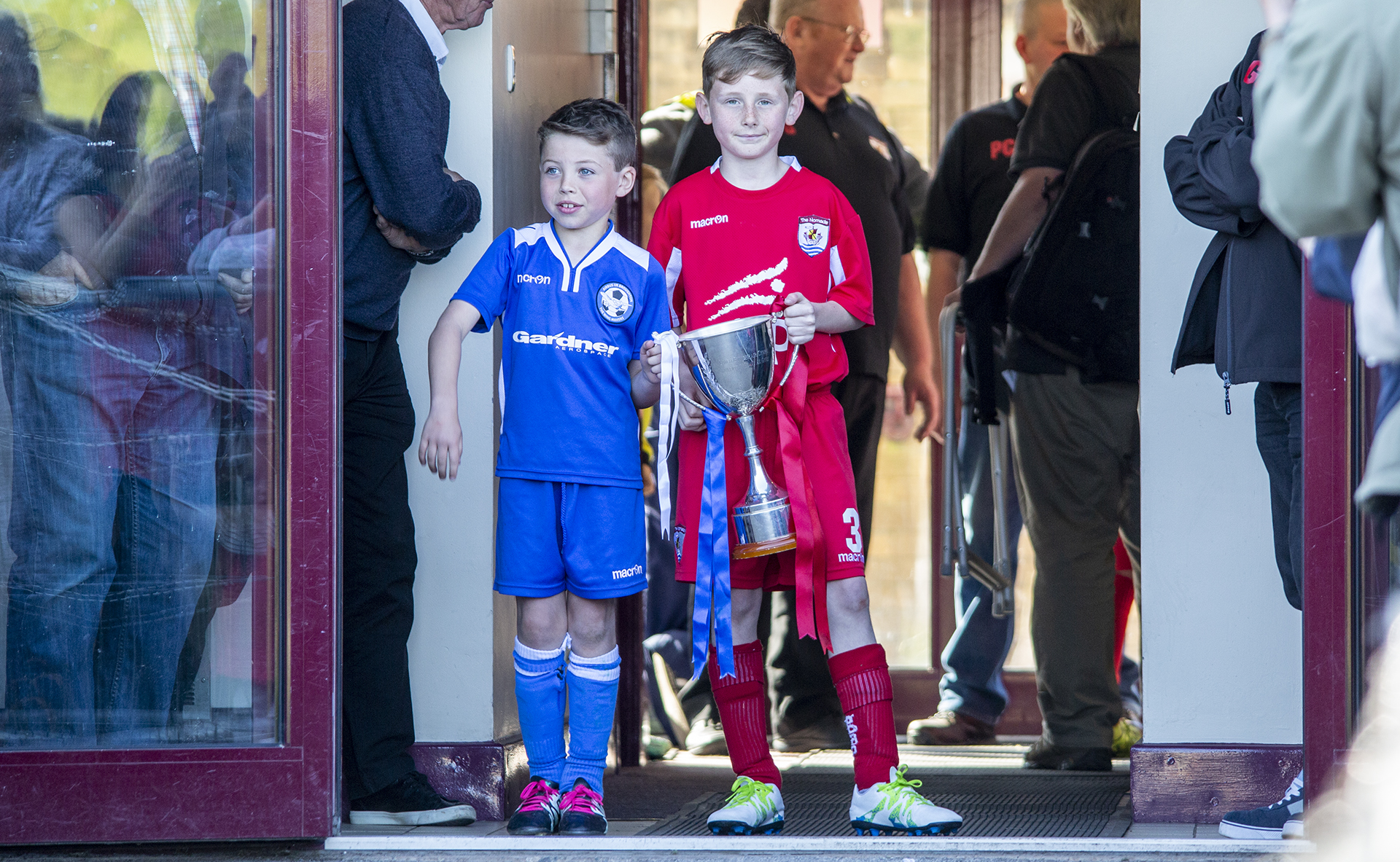 Airbus and Nomads mascots prepare to present the trophy ahead of kickoff | © NCM Media