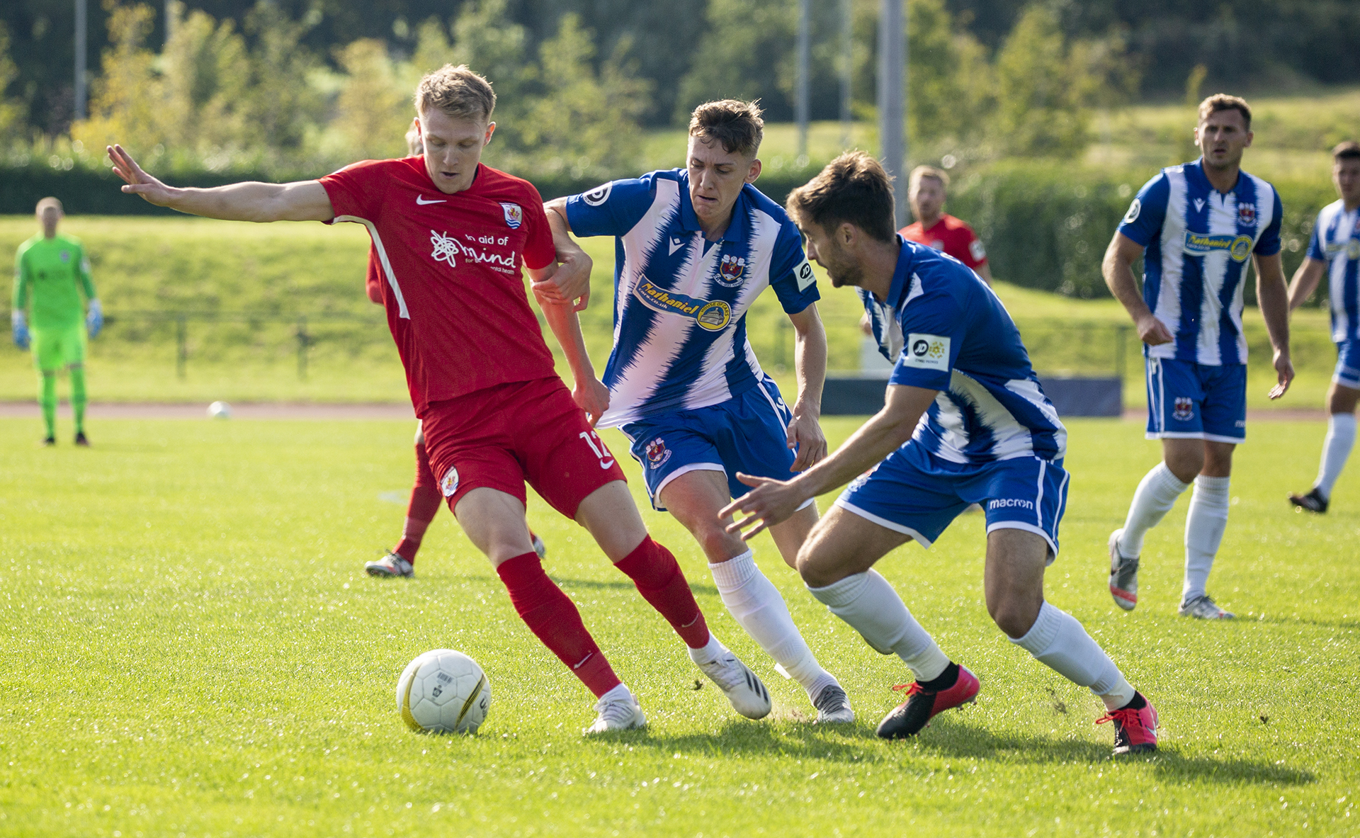 Declan Poole is tightly marked by Penybont players | © NCM Media