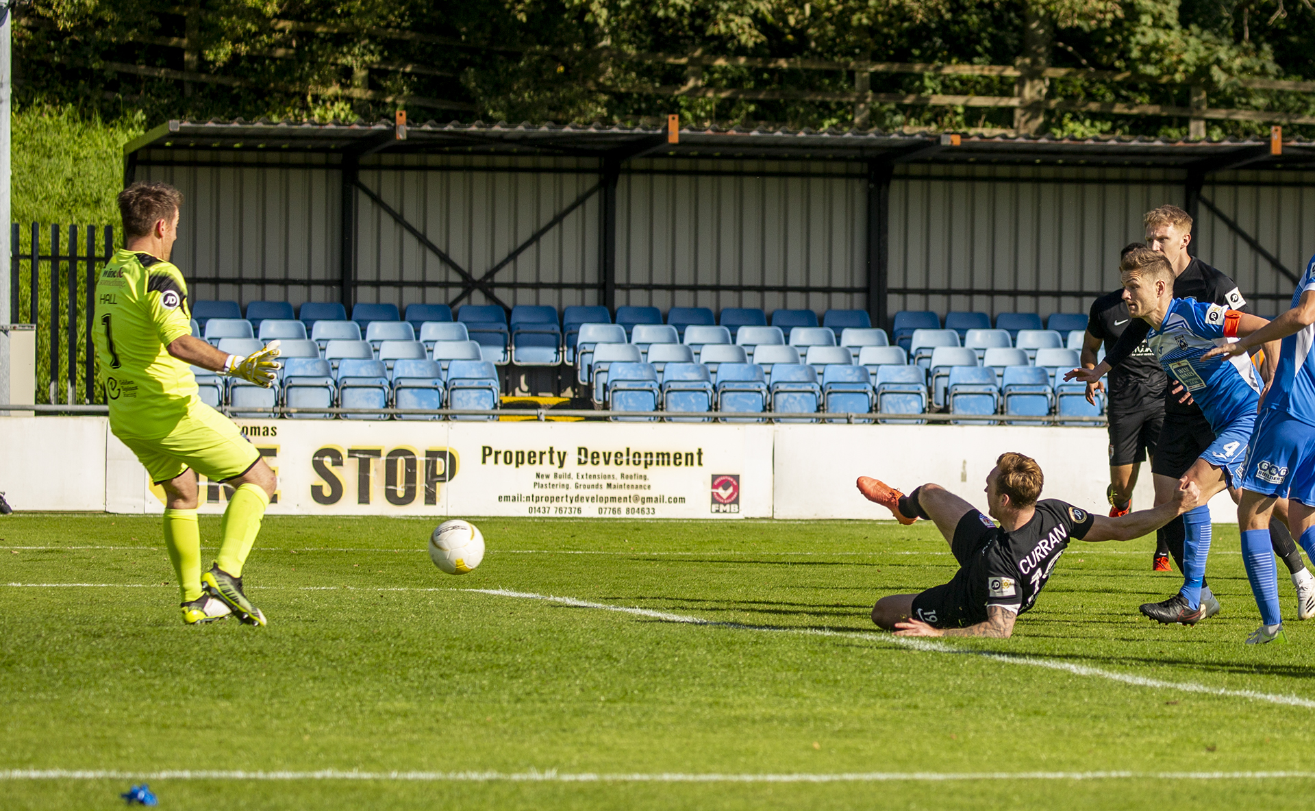 Craig Curran slides his second goal in | © NCM Media