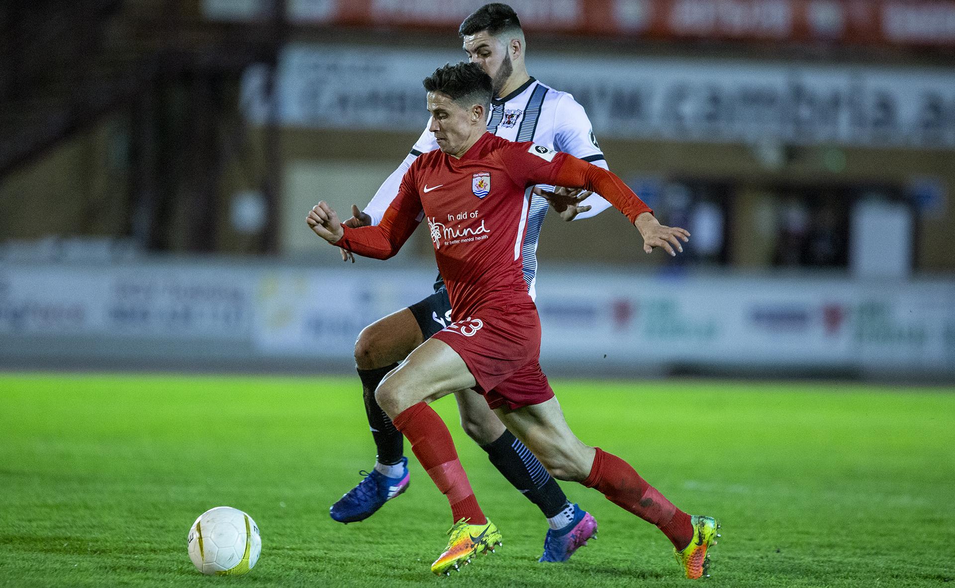 Aeron Edwards bursts into the Druids' box | © NCM Media