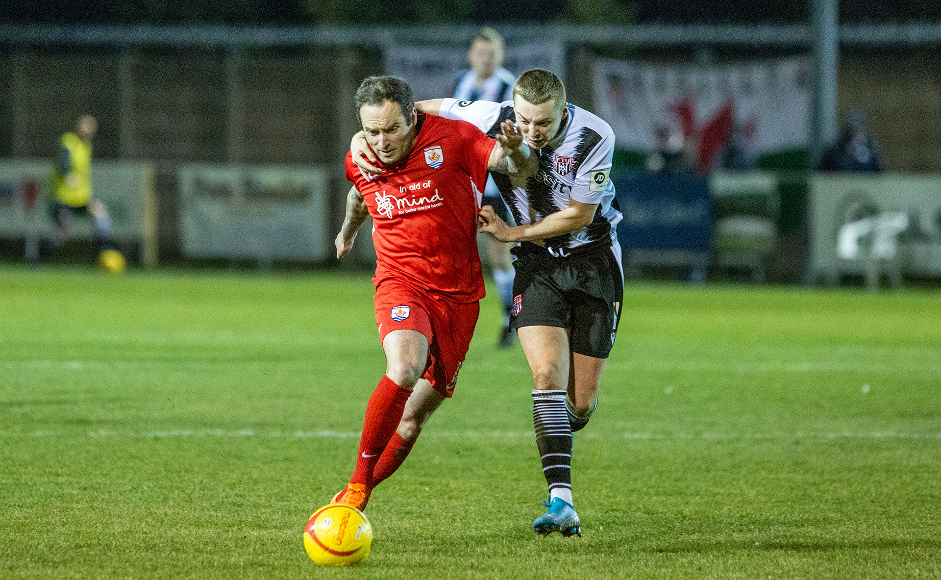 Danny Holmes clashes with ex Nomads Rob Hughes | © NCM Media