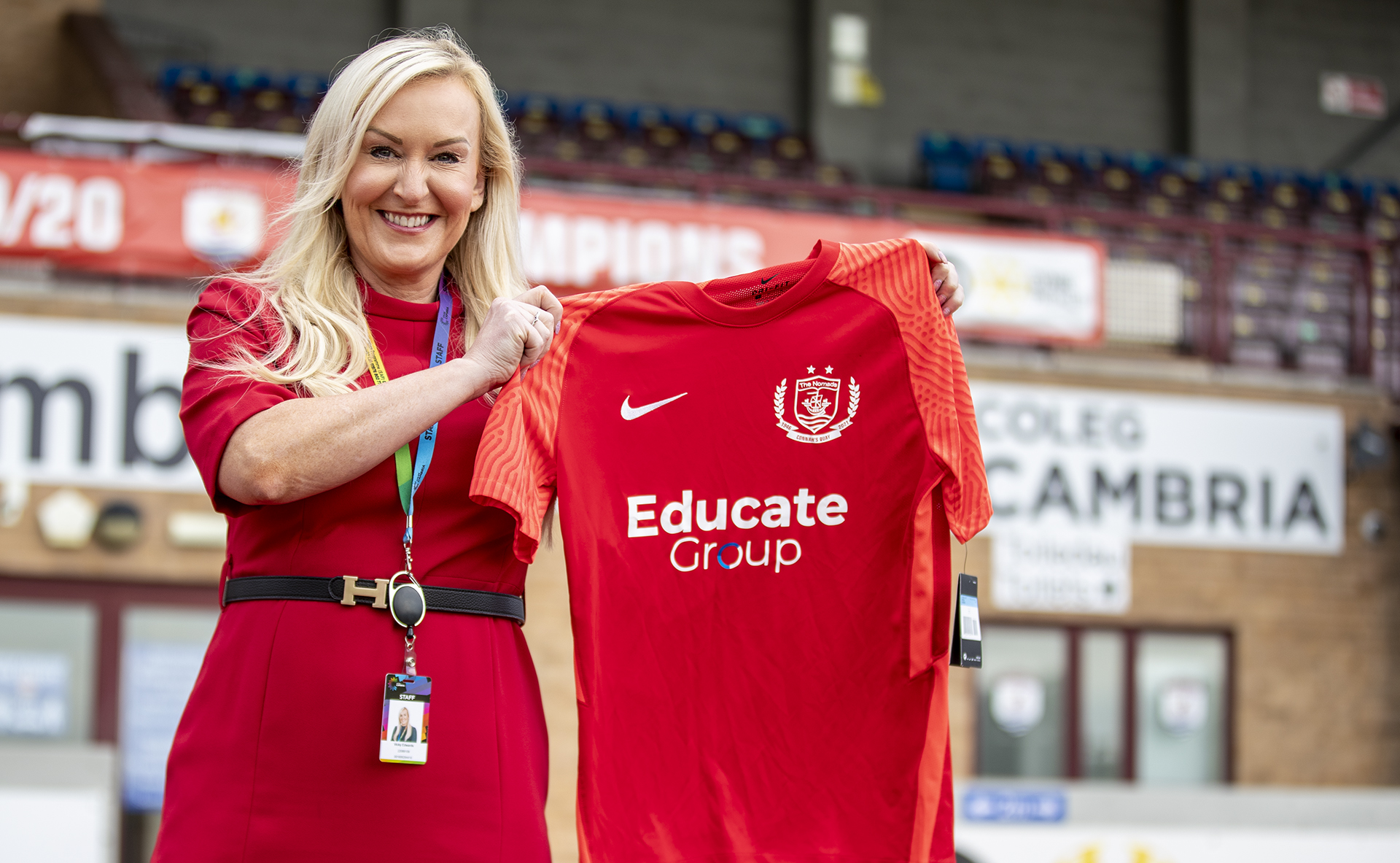 Victoria Edwards (Vice Principal Technical Studies at Coleg Cambria) with the new Connah's Quay Nomads home shirt at Deeside Stadium
